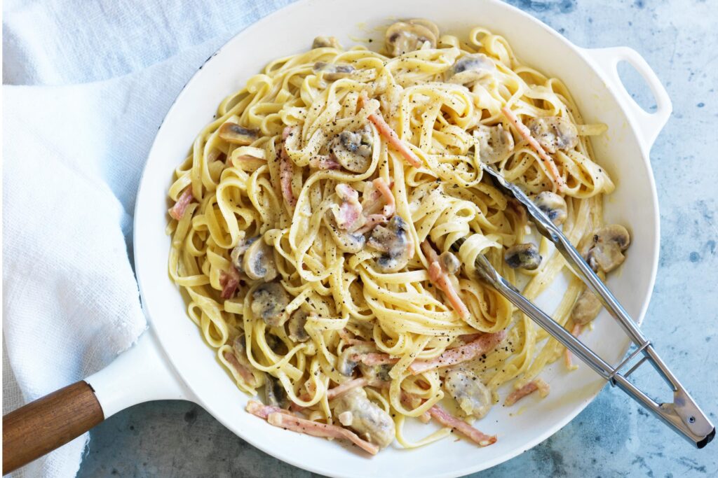 Mixing Carbonara With Sauce 